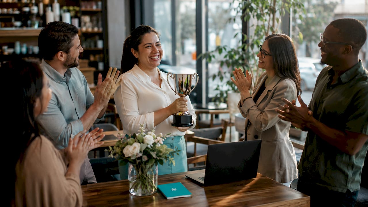 Team leader receiving workplace recognition
