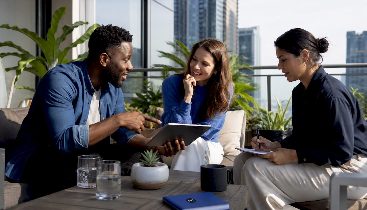 Team collaborating on virtual real estate tour in office