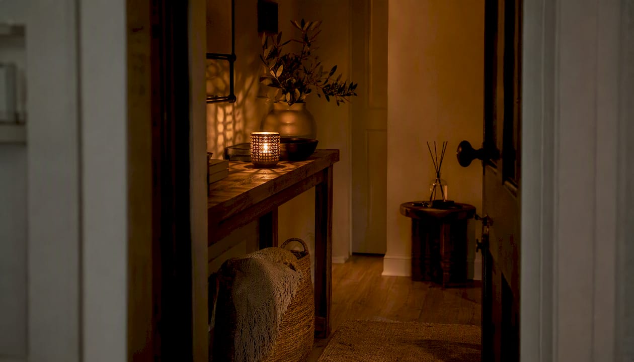 Welcoming candle and diffuser setup in entryway