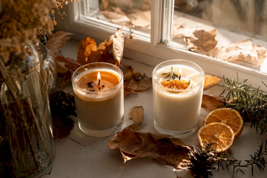 Amber and citrus scent candles with natural accents