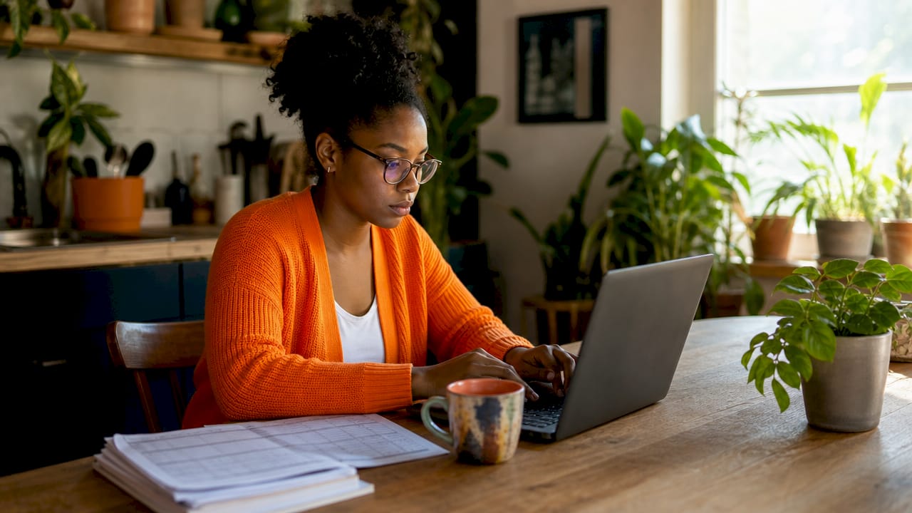 Subcontractor analyzing bid win rates on laptop