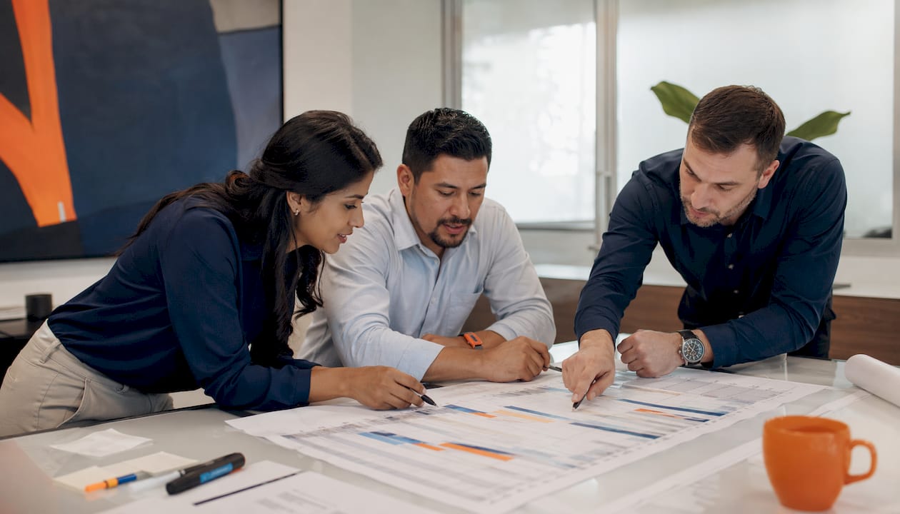Team reviewing project schedules and budgets