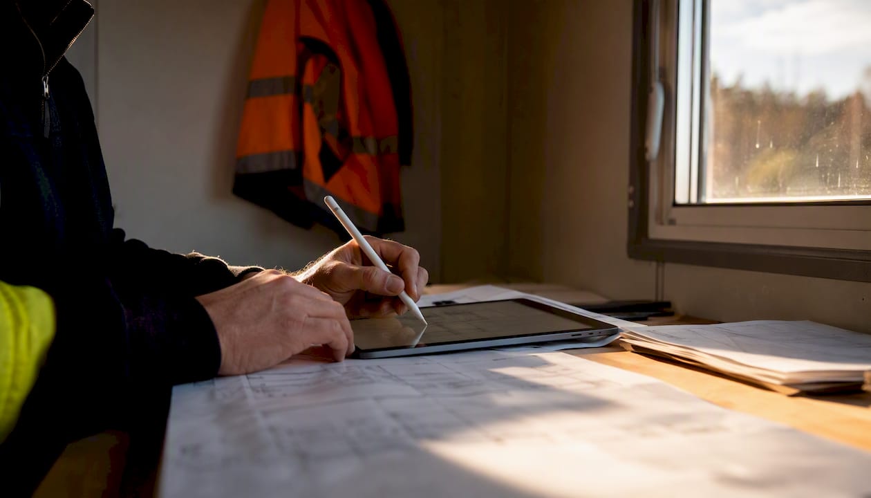Hands performing digital takeoff on tablet