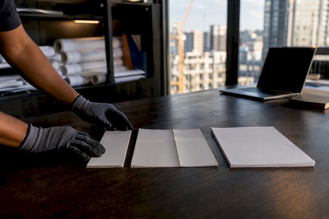 Hands matching ticket, invoice, and contract sheets