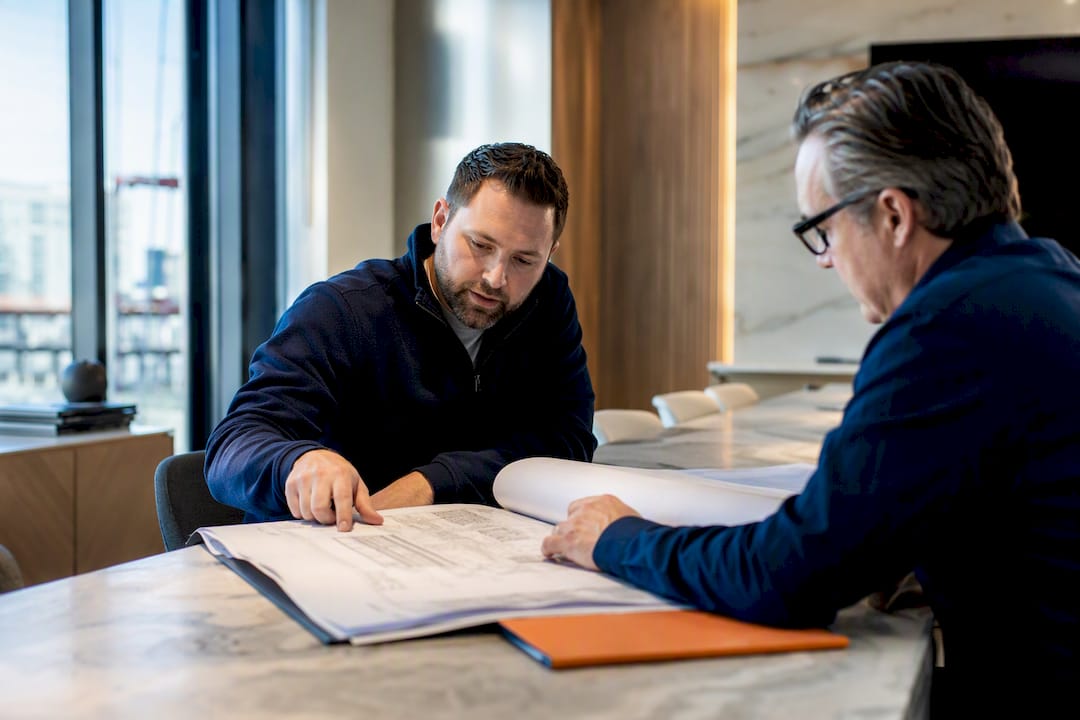 Contractor and owner reviewing change order