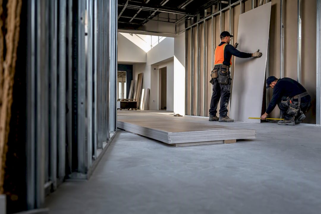 Drywall crew working inside commercial build-out
