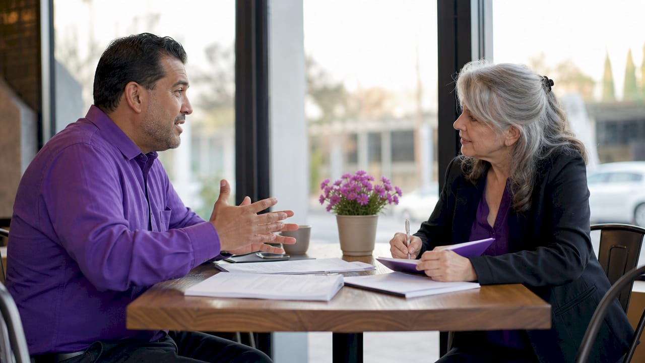 Two brokers negotiating referral fees over documents