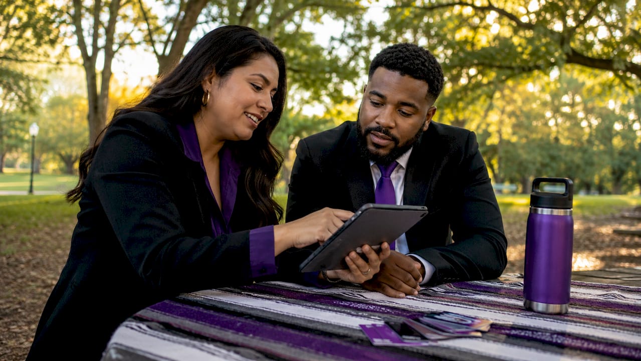 Real estate agents discussing digital payments benefits