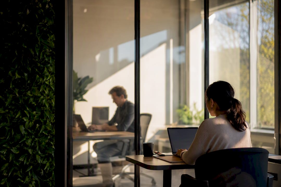 Office partition symbolizing dual agency confidentiality