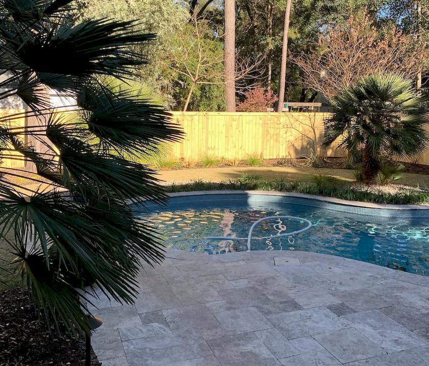 Row of privacy fences of varying heights outdoors