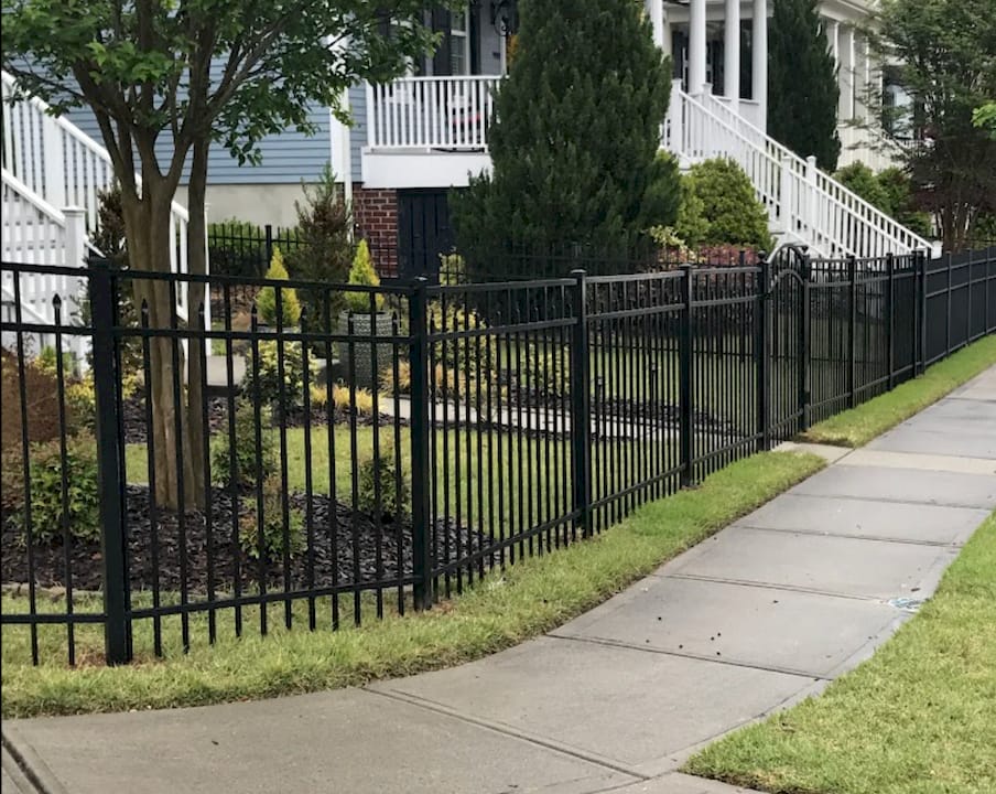 Close-up of decorative spear-topped aluminum fence