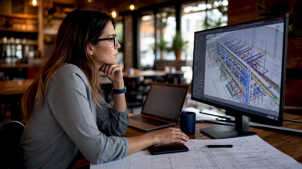 Electrical engineer reviewing federated BIM model in office