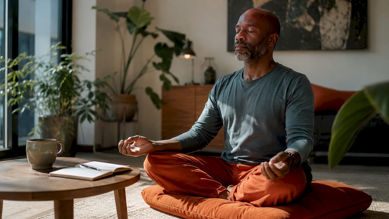 Man meditating at desk for short sessions