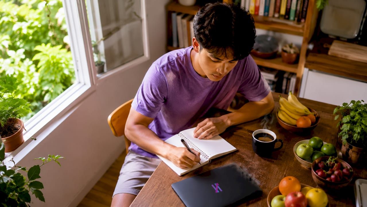 Young man working on algorithmic trading setup at home