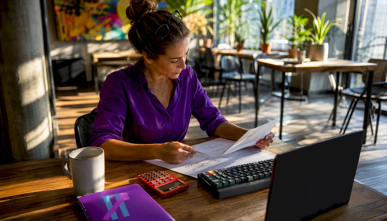 Trader reviewing mechanical trading rules at home office