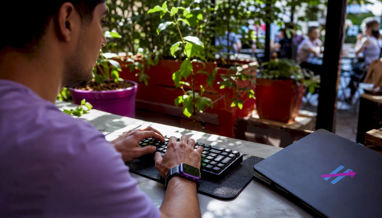 Close-up of hands typing on keyboard