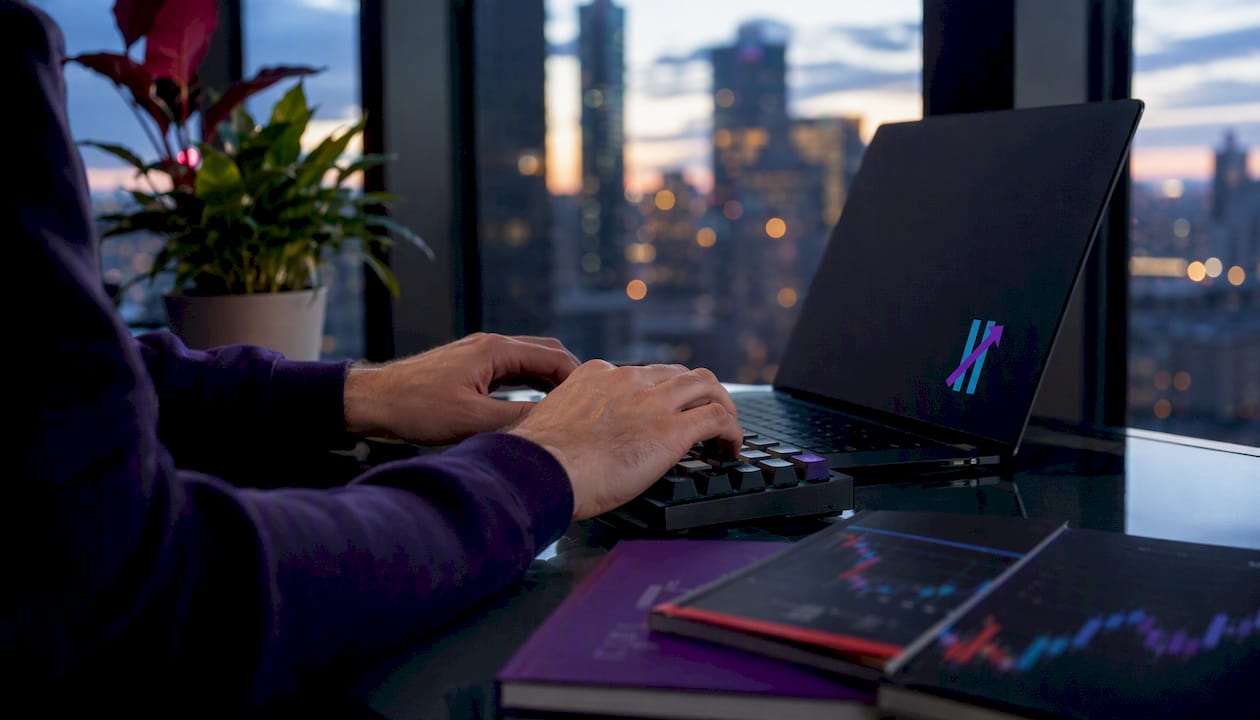 Hands typing on keyboard with laptop off