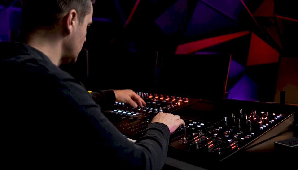 Trader adjusting dials on control panel