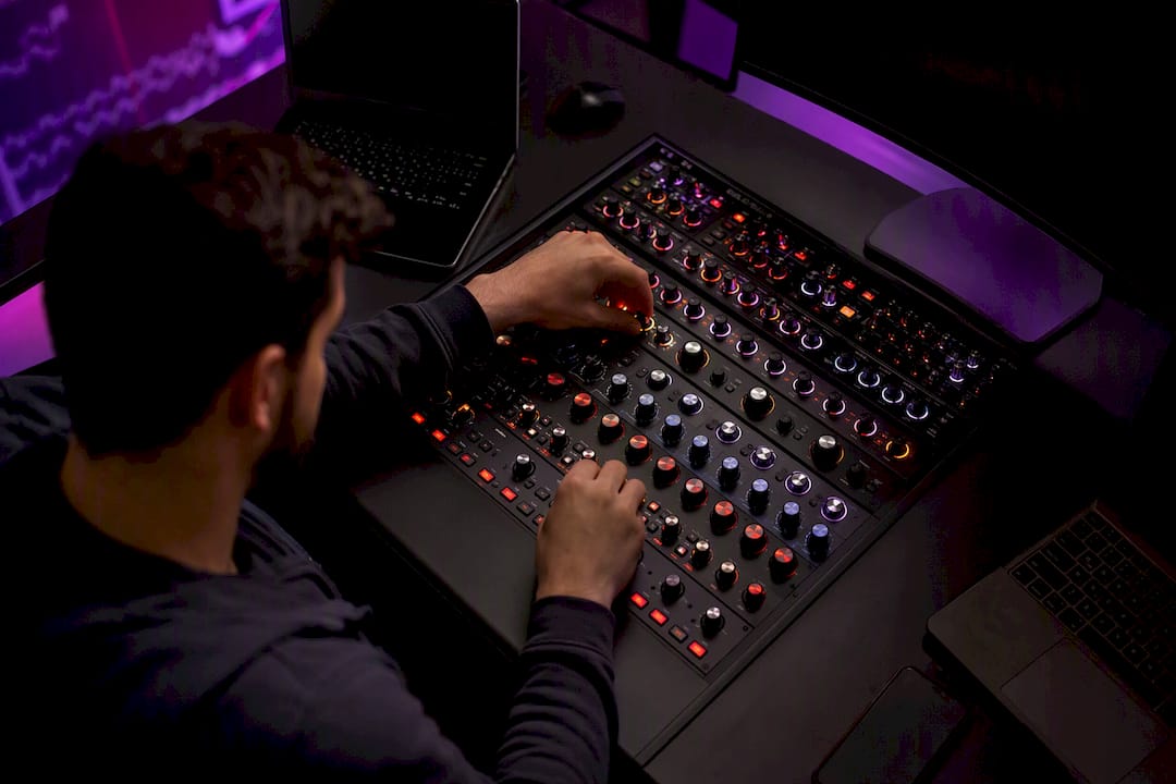 Trader hands adjusting trading dial close-up