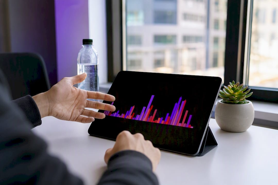 Hand gesturing over volume bars on printed chart