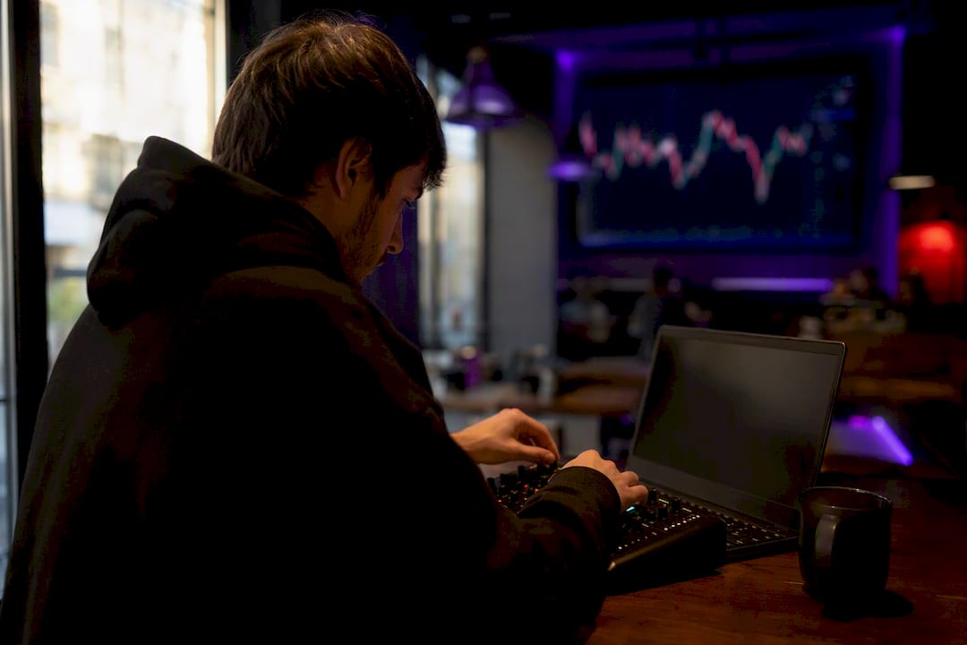 Hands adjusting trading control dial