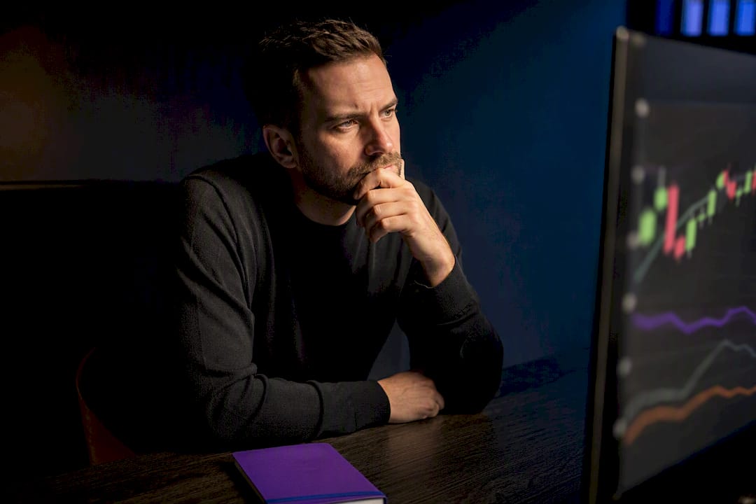 Analyst studying trend indicator charts