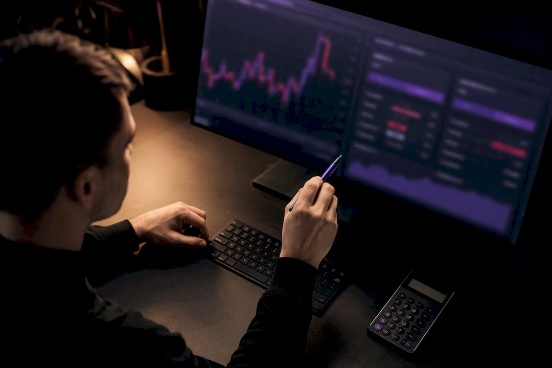 Trader comparing bid ask and fee costs