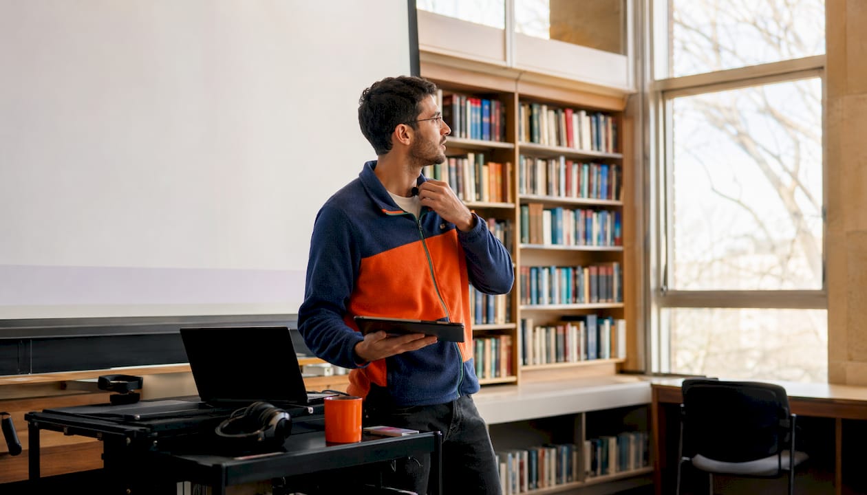 Educator setting up virtual classroom equipment
