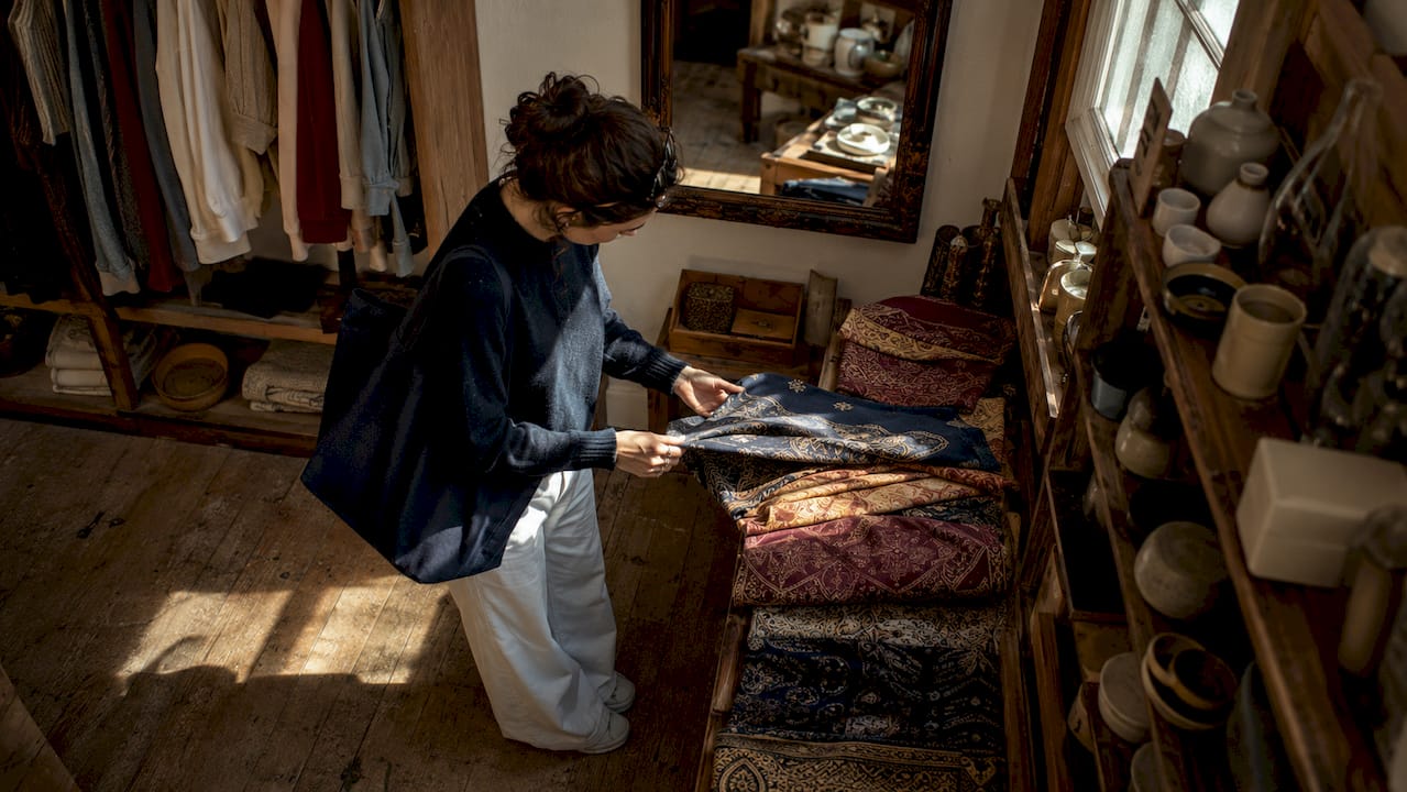 Customer browsing independent shop in Totnes