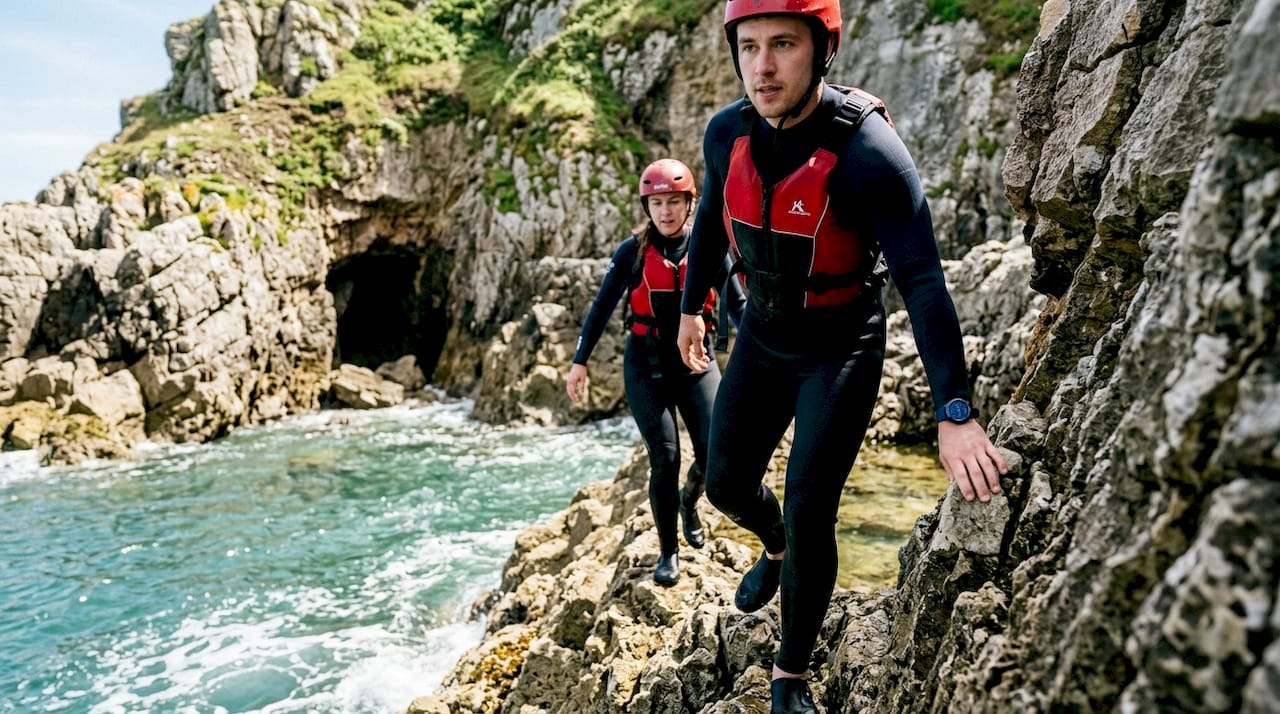 Group climbing limestone cliffs at Baggy Point