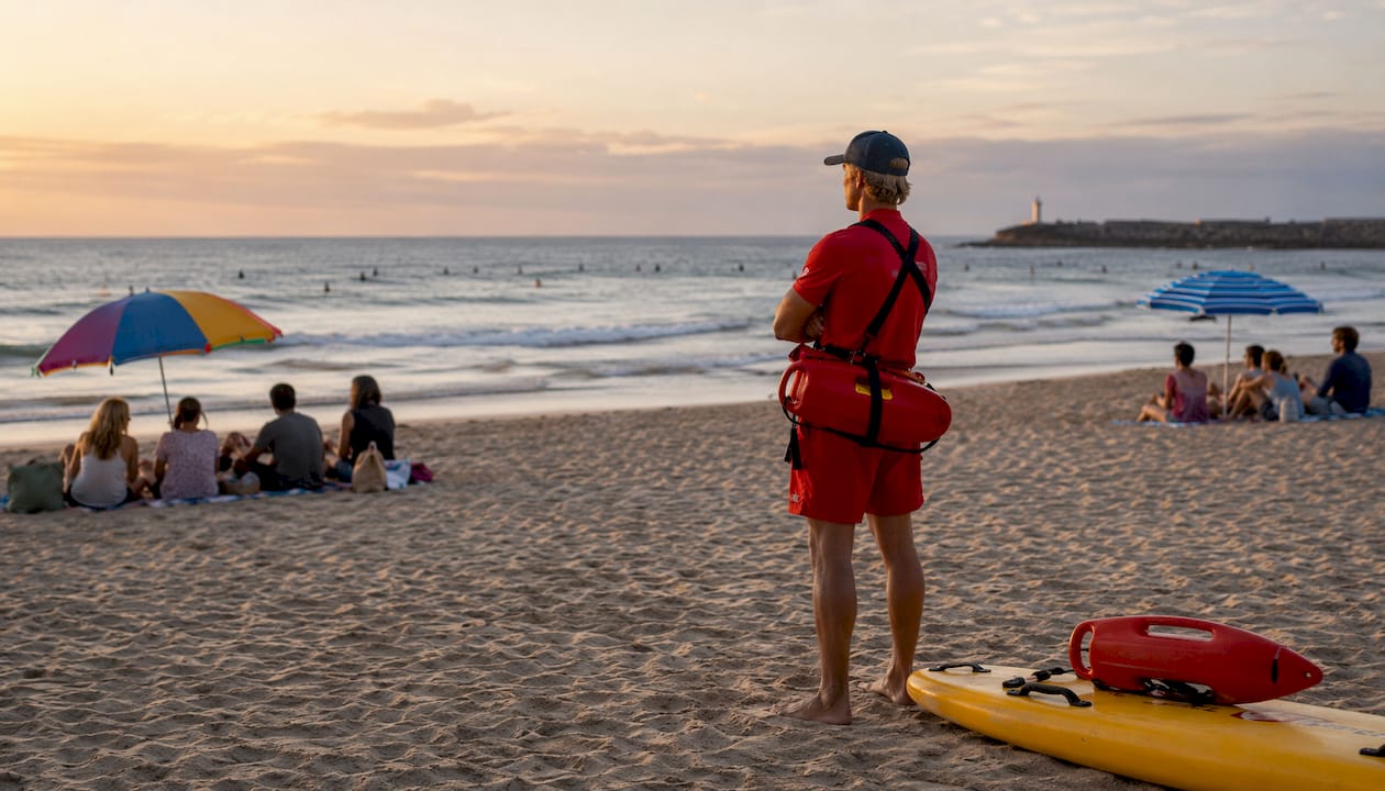 Lifeguard watching surfers at Croyde Bay