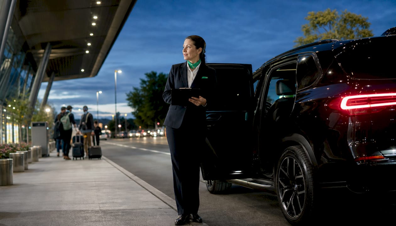 Private transfer driver waiting outside airport terminal