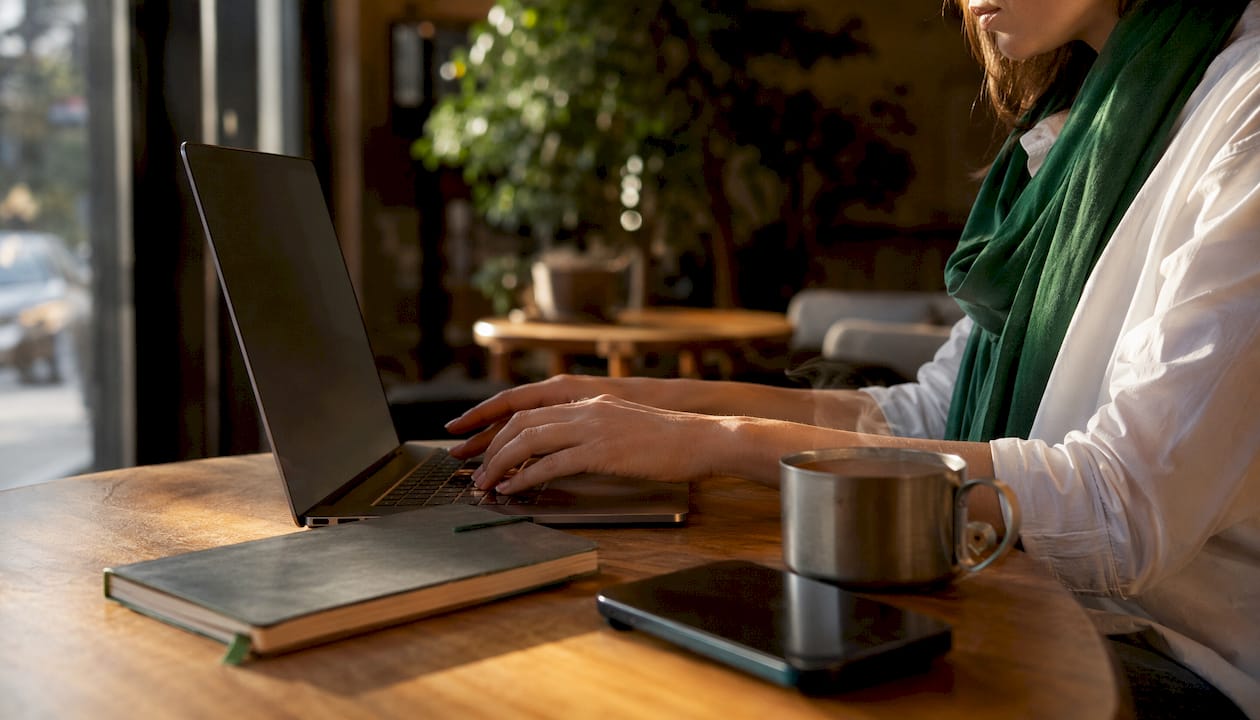 Hands typing API integration notes at desk