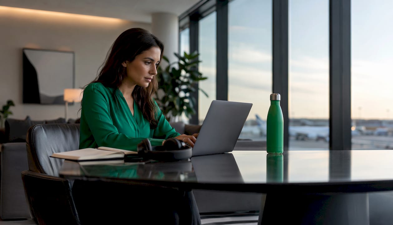 Travel coordinator managing flight disruptions