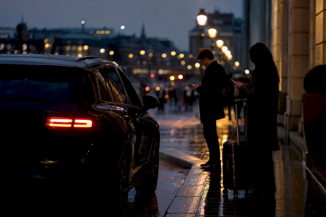 Backup vehicle waiting on urban street at dusk