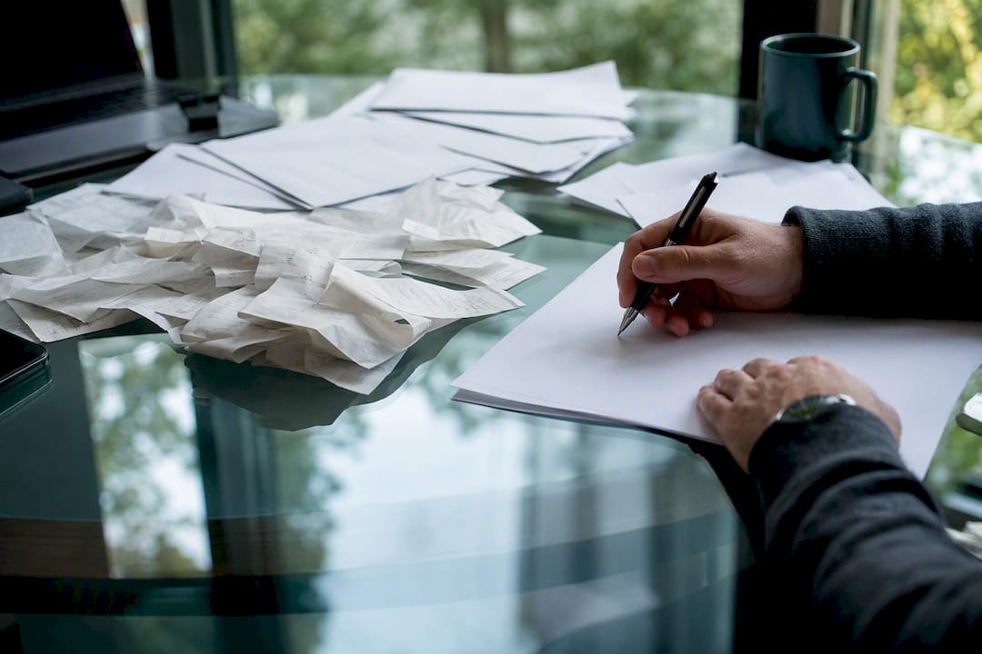 Hands over unbranded transfer invoices and receipts