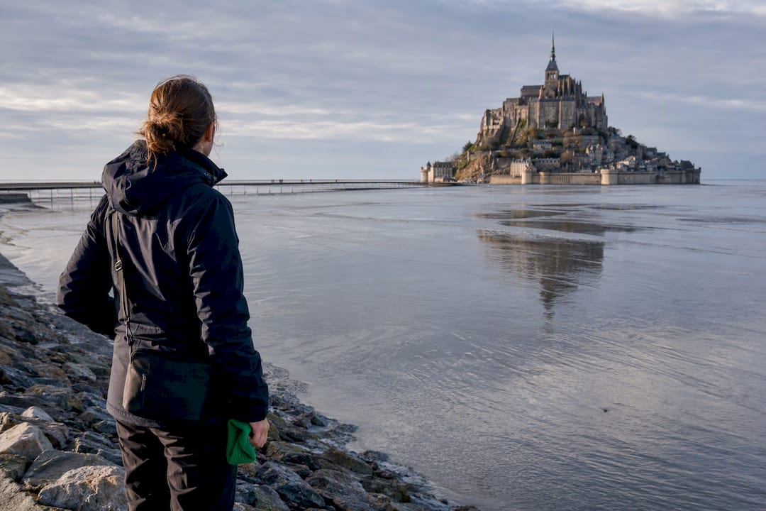 Visitor viewing Mont Saint Michel tidal bay