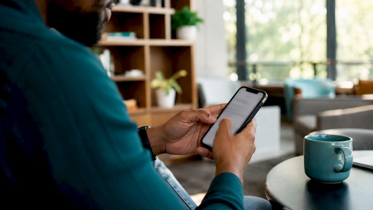 Hands signing electronic waiver on smartphone