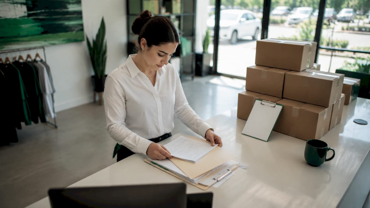 Single-unit franchise manager organizing documents