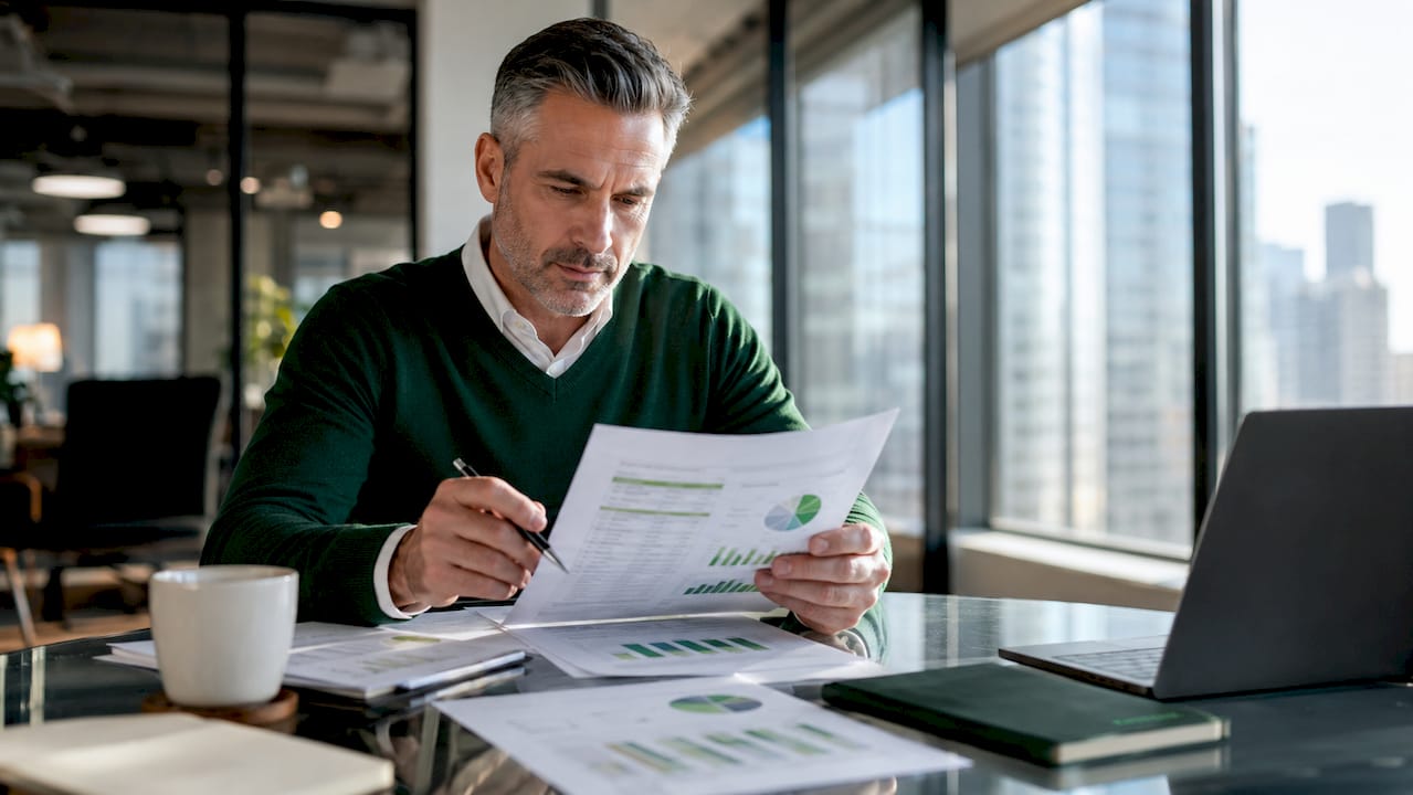Franchise owner reviewing financial documents