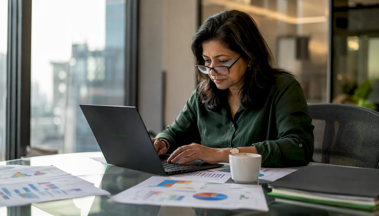 Businesswoman reviewing franchise financial documents