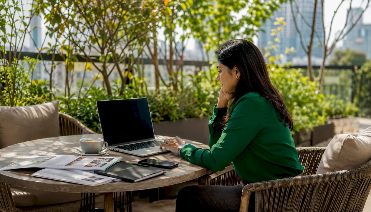 Person researching franchise listings at home desk