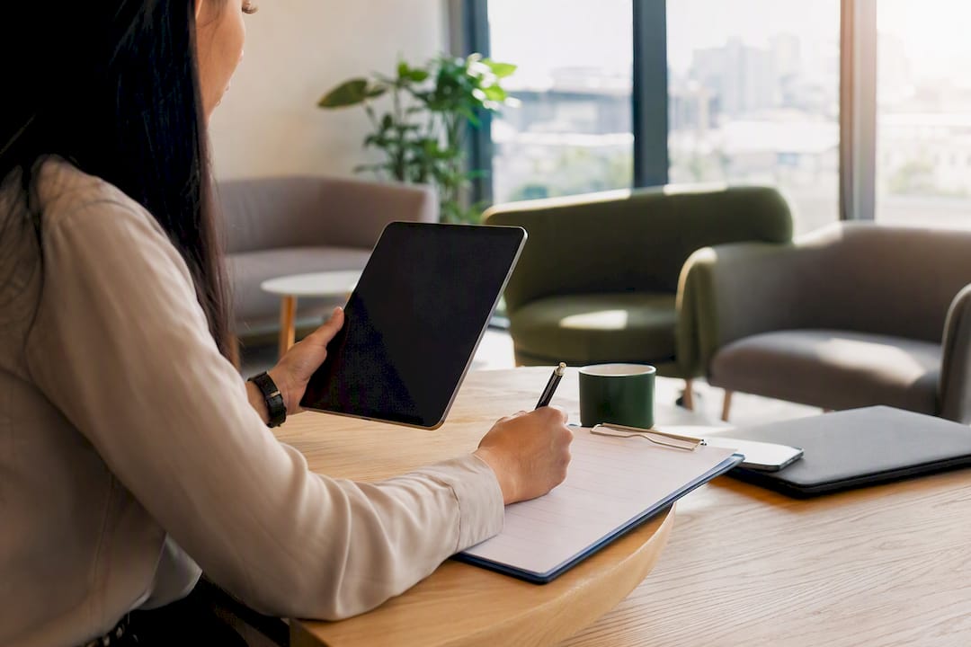 Hands verifying franchise candidate information