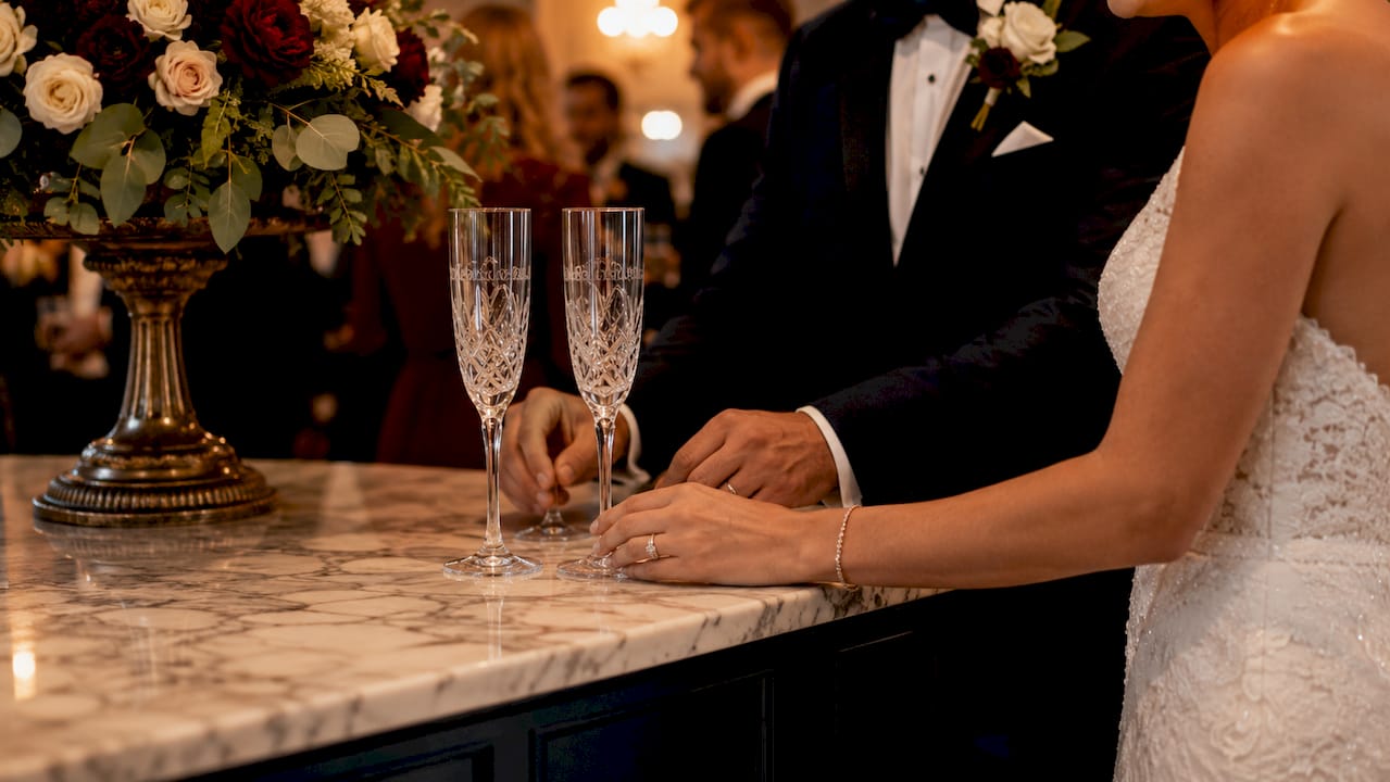 Close-up hands with engraved wedding gifts