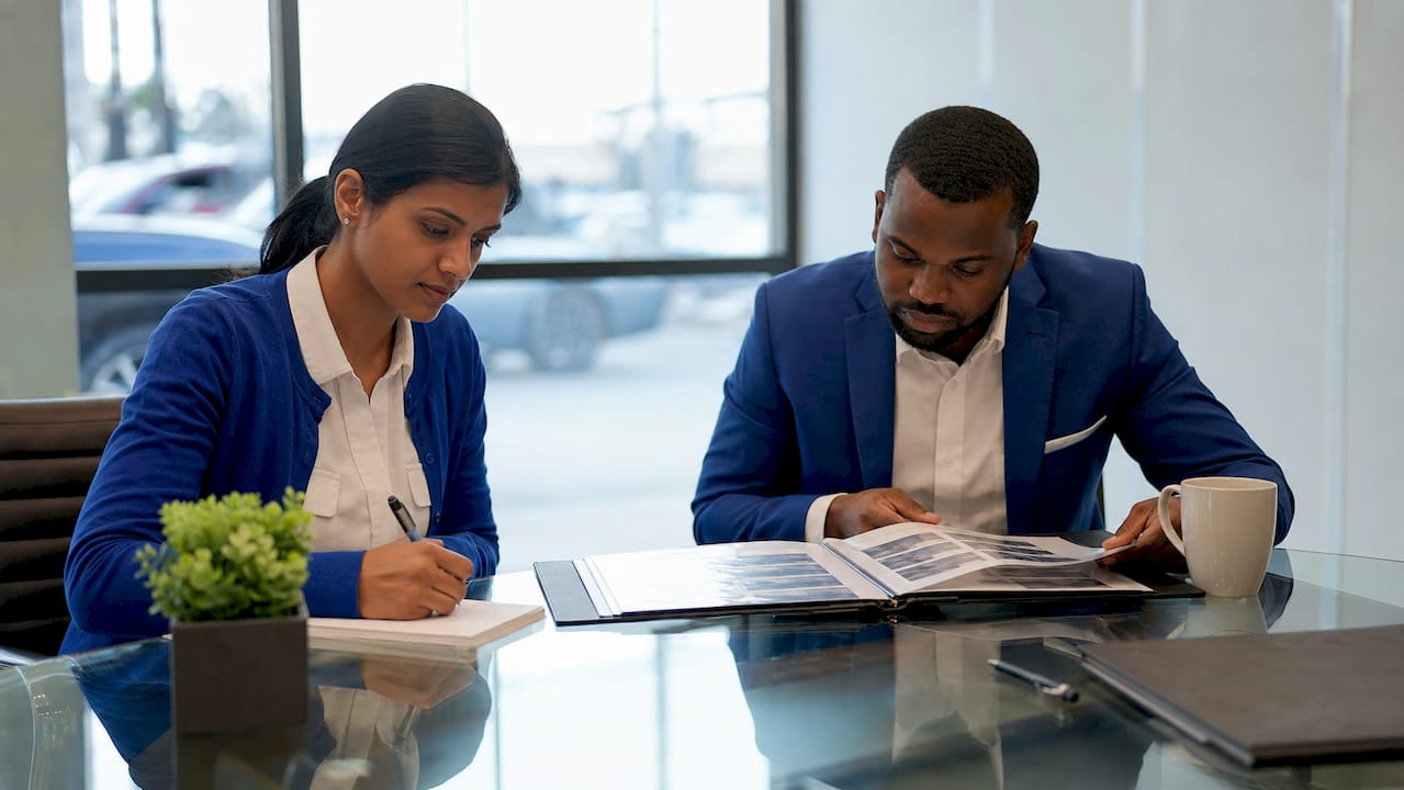 Dealership staff doing manual vehicle search tasks