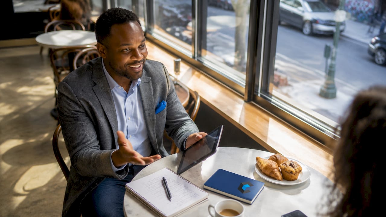 Hands reviewing SaaS sales pipeline documents
