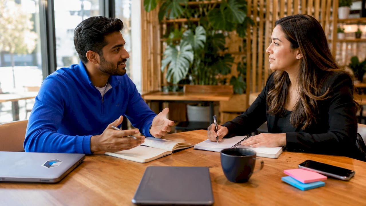 Startup founder and recruiter discussing sales hiring