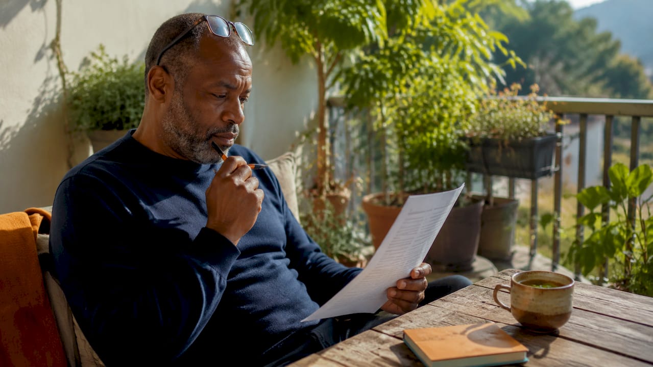 Man reviewing motorcycle insurance paperwork