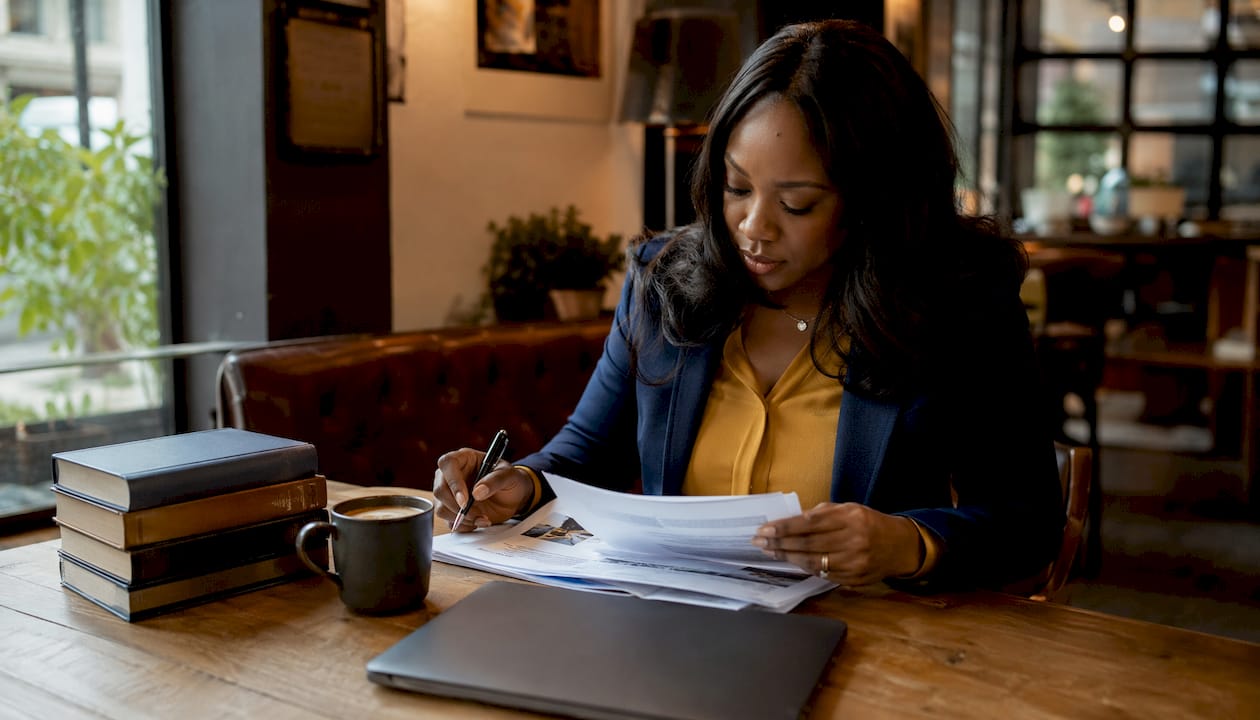Lawyer reviewing lemon law documents closely