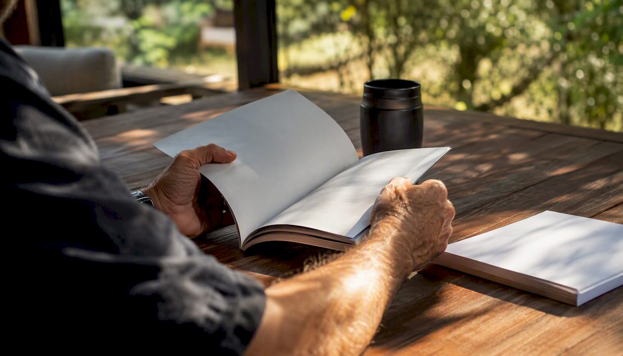 Hands reading motorhome warranty booklet